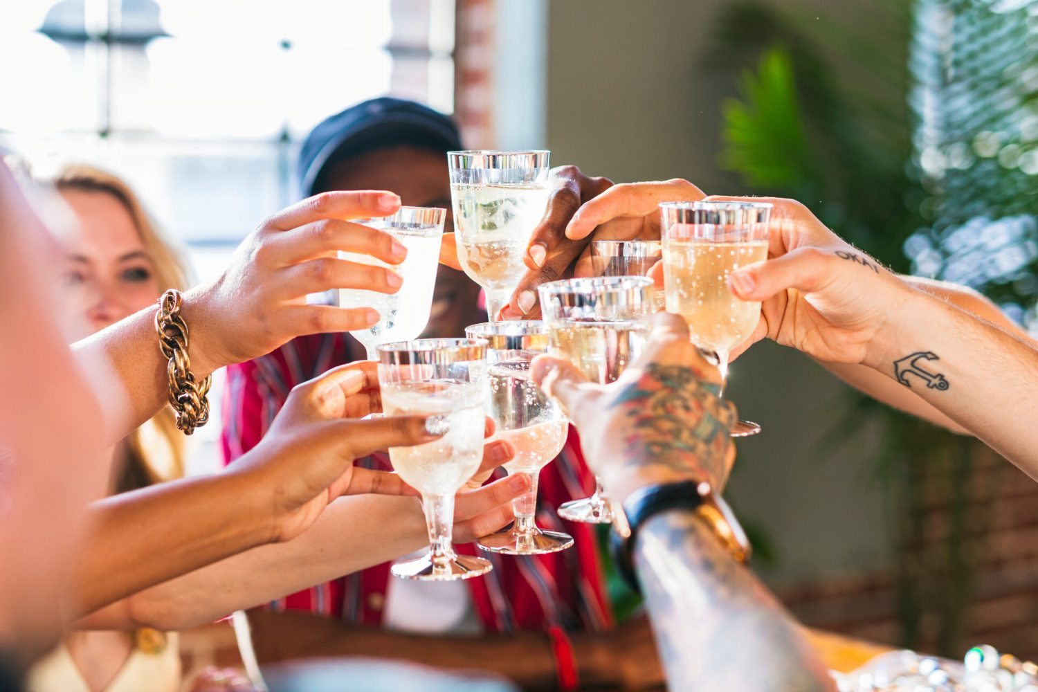 A group of diverse friends toasting at a party